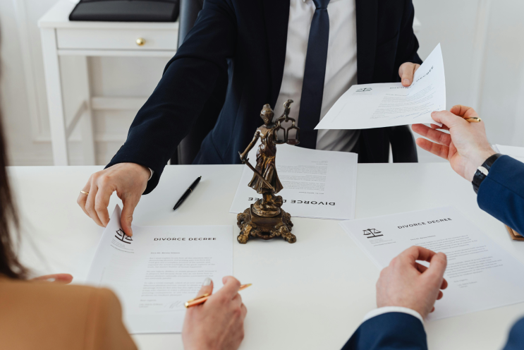Attorneys reviewing legal documents with a client